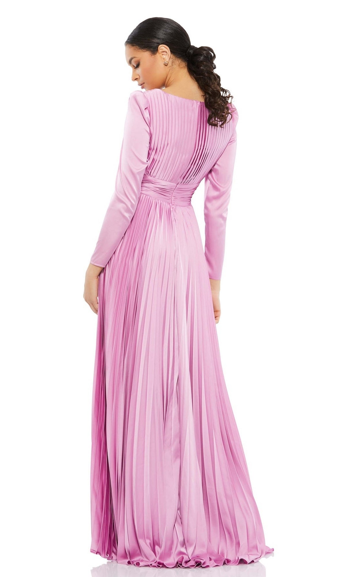 A woman, her hair in a low ponytail, models the Long Formal Dress 26542 by Mac Duggal—pink, pleated, long-sleeved with a v-neckline—shown from the back.